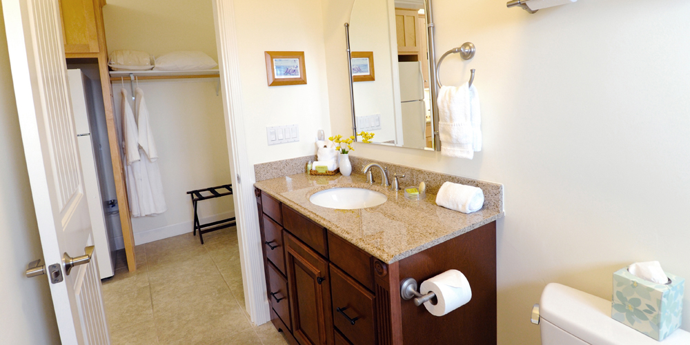 Large bathroom with granite slab counter tops